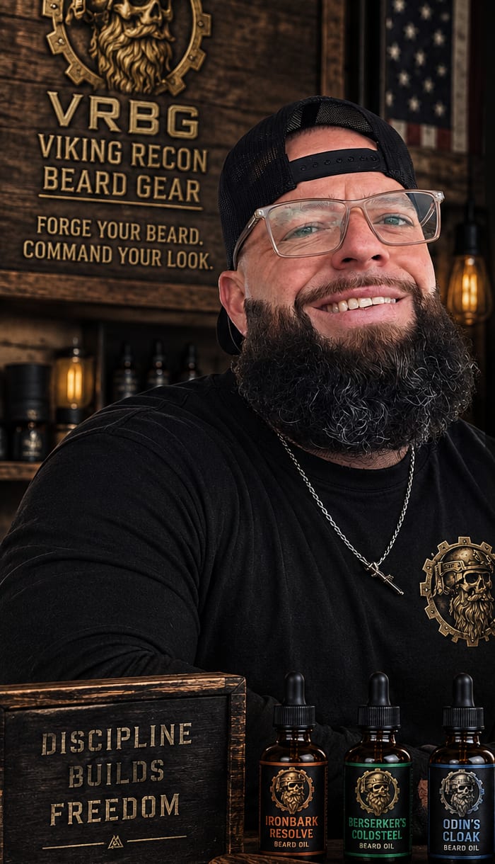 Chase, founder of Viking Recon Beard Gear, smiling behind the counter with the three beard oils and a VRBG comb.